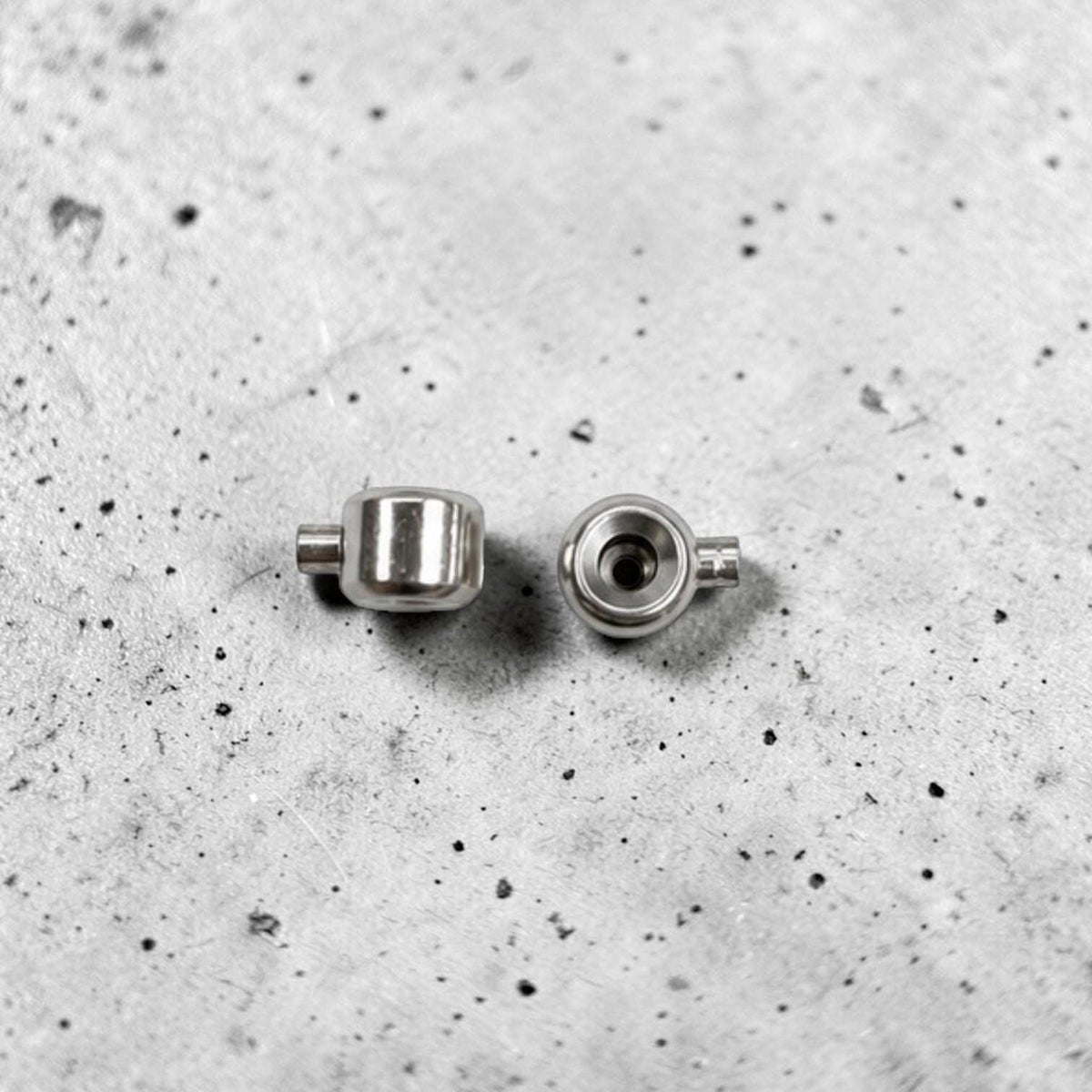 Stainless steel jewelry findings for securing cord ends on necklaces, bracelets, and anklets.