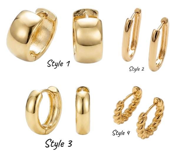 Close-up of wide, chunky 18k gold-filled huggie hoop earrings with a high-polish finish and a thick, rounded profile.