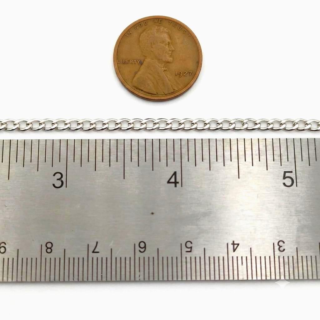 A top-down view of the 3mm stainless steel curb chain laid flat next to a clear ruler showing the precise 3mm link width.