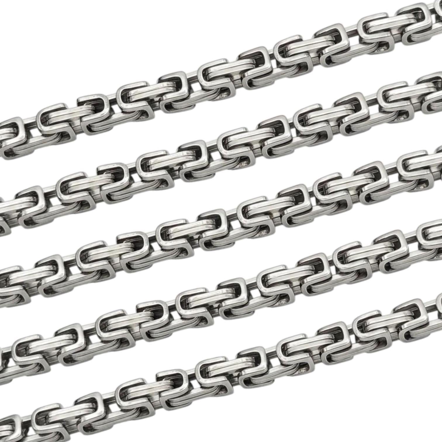 Stainless steel rectangle link chain on a white background