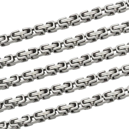 Stainless steel rectangle link chain on a white background