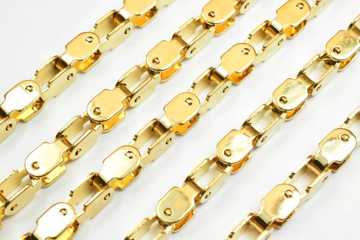 a close-up view of several gold-colored metal chains arranged in a repeating pattern.