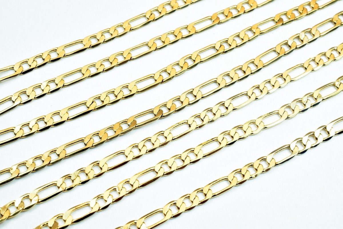 A collection of gold-colored metal chain necklaces arranged in a grid-like pattern on a white background.