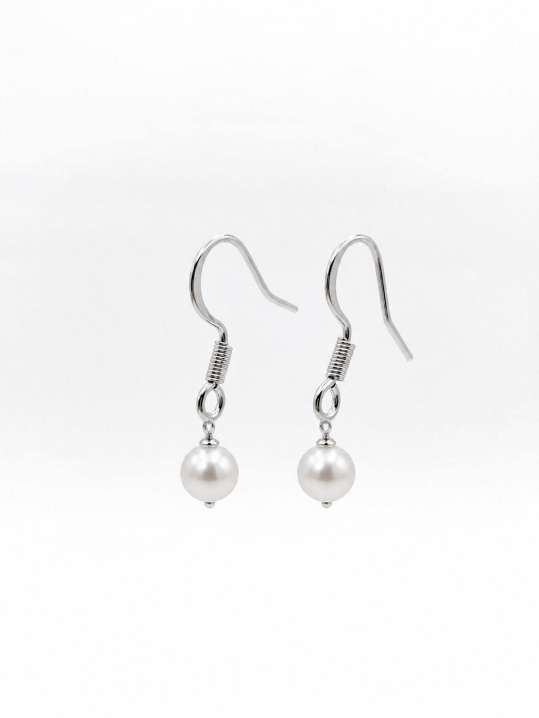 Silver stainless steel fish hook ear wires angled to show the elegant curve and loop for attaching handmade charms or pearls.