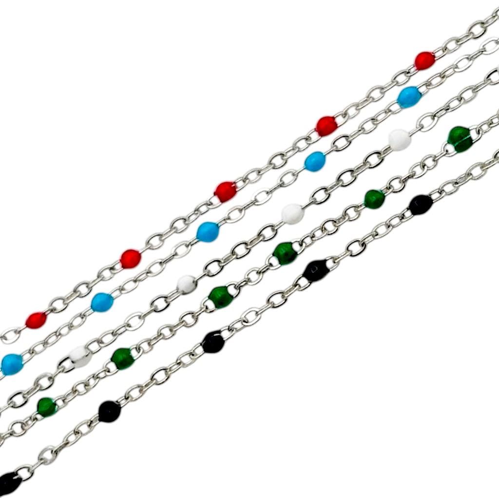 All five color options (red, blue, white, green, black) displayed together on a jewelry card to show the vibrant color palette.