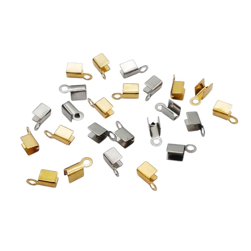 Two pairs of fold-over crimp end caps for jewelry making, shown in both sleek silver stainless steel and polished premium gold finishes, featuring open U-channels and sturdy top loops.