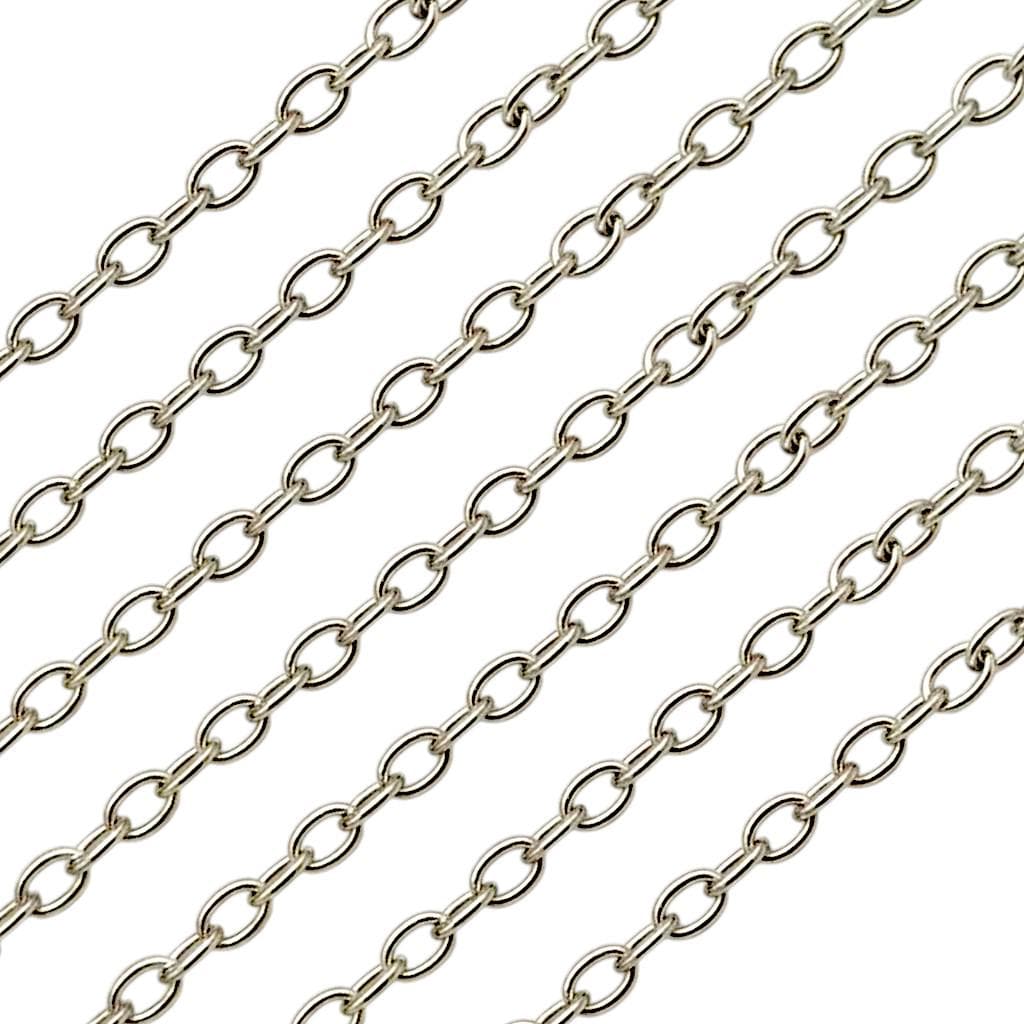 A hand attaching a stainless steel lobster clasp to the cable link extension chain to demonstrate jewelry assembly.
