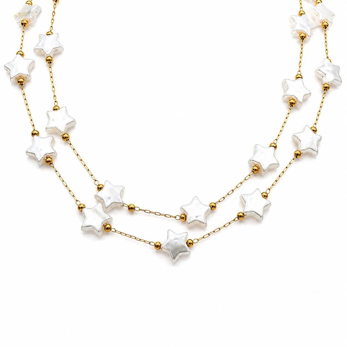 Gold stainless steel chain with white artificial star pearls displayed on a clean white background.