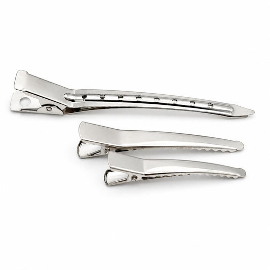 Silver metal alligator hair clips in three assorted sizes displayed on a clean white background
