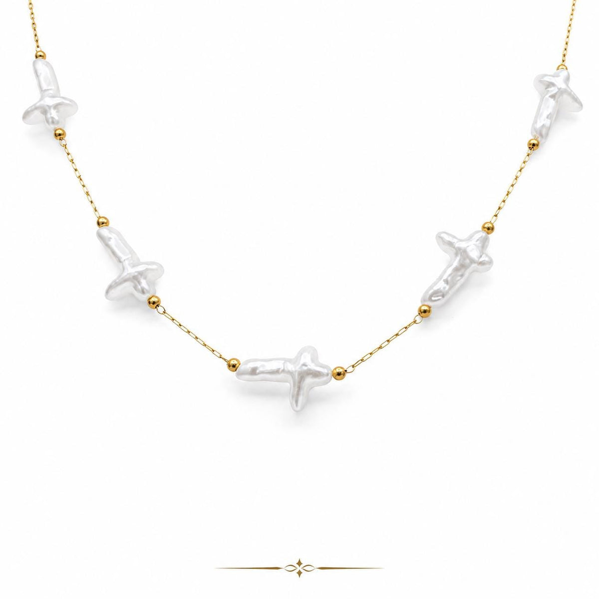 Gold stainless steel jewelry chain with white artificial cross pearl beads, sold by the yard or 10 yards for necklace, bracelet, rosary, and DIY jewelry making.