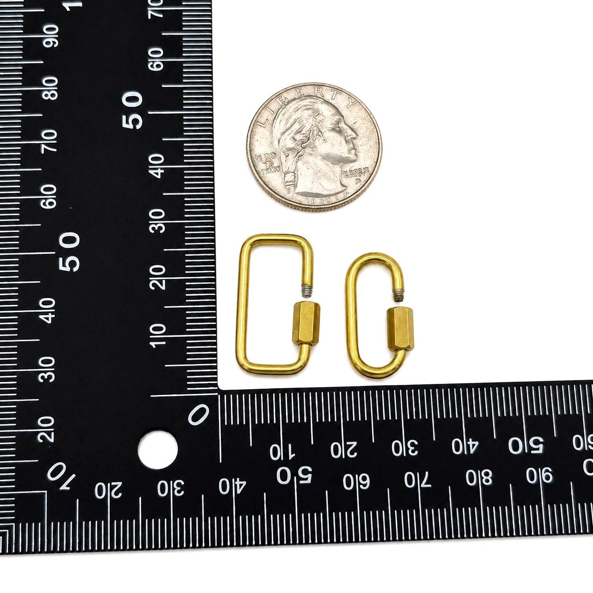 Gold stainless steel screw lock clasp in rectangle and oval shapes on a white background and ruler
