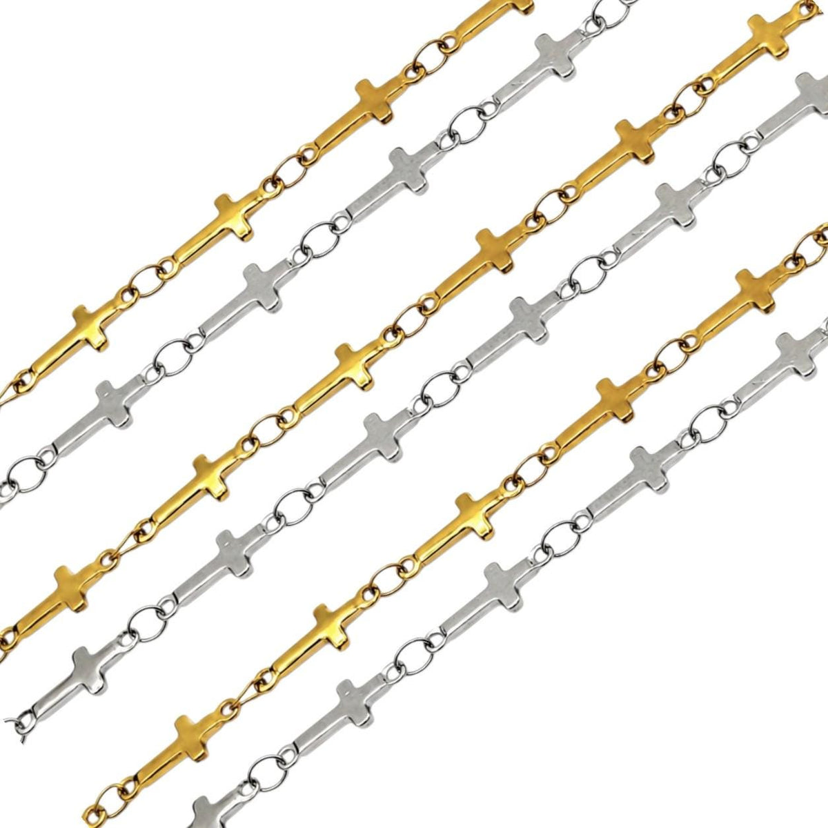 Gold and silver stainless steel cross chain displayed in curved layered rows on a white background