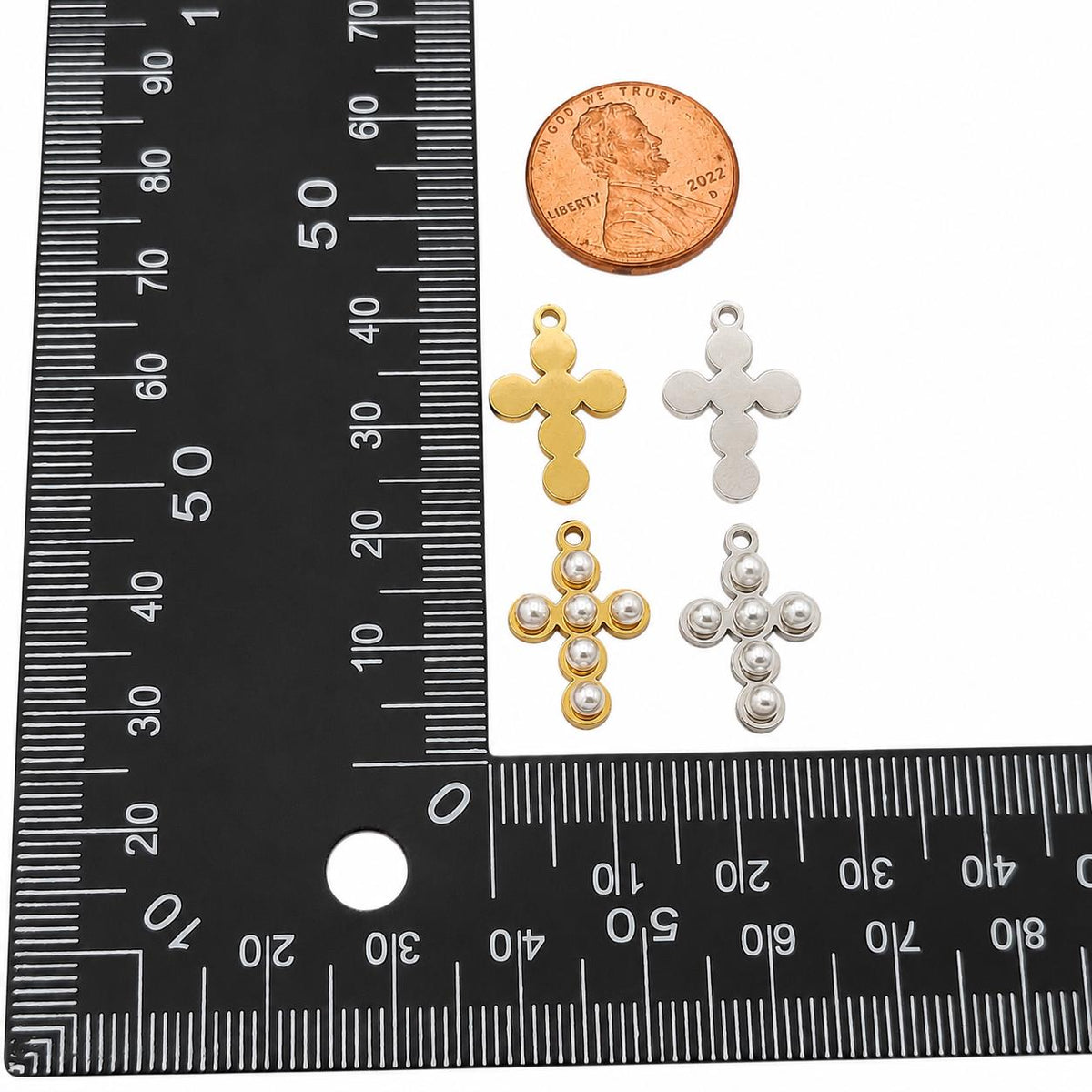 Front and back view of stainless cross charms in gold and silver colors