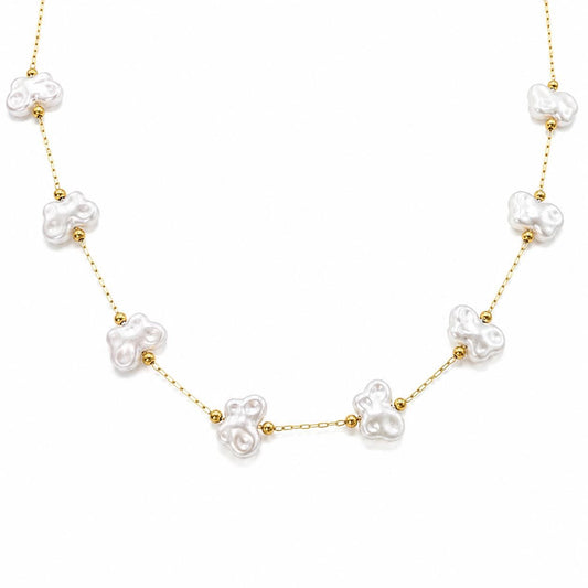 Gold stainless steel chain with white artificial pearl butterfly links displayed on a white background